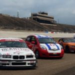 Cars lined up in pit lane at Texas World Speedway for the 2015 Memorial Weekend Grand Prix.